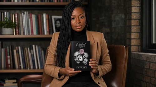 Linda Orji holding Cracked Concrete Volume I